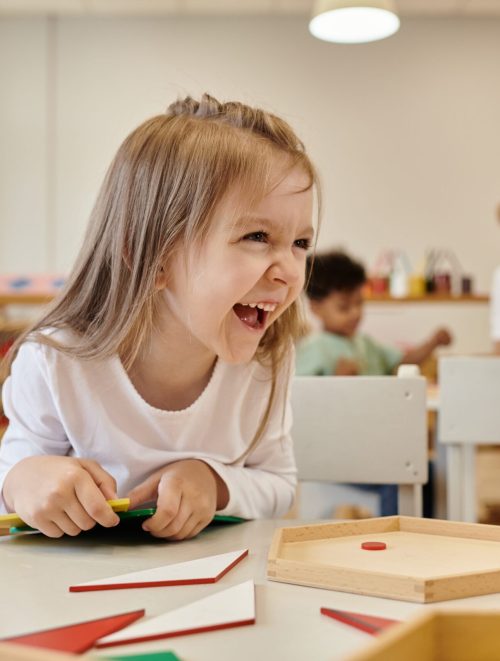 Cheerful,Kid,Looking,Away,Near,Didactic,Materials,In,Class,Of Cheerful,Kid,Looking,Away,Near,Didactic,Materials,In,Class,Of